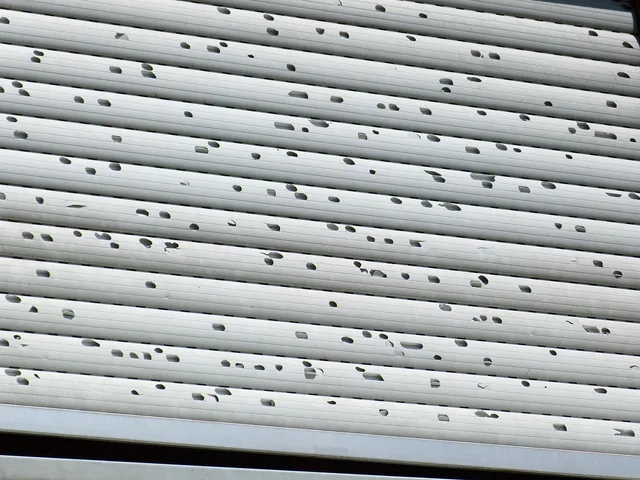 roller shutter, dents, hail damage, damage, damaged, a hit, impact holes, hail, holes, hail holes, broken, over, hail damage, hail damage, hail damage, hail damage, hail damage, hail, hail, hail, hail. How Denver hail and UV drive exterior coating and insurance repaint demand